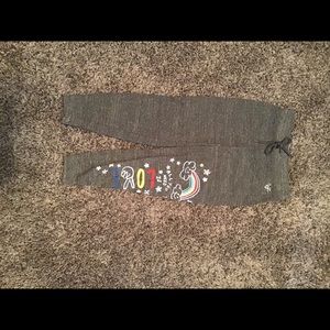 Gray sweatpants with sayings on them